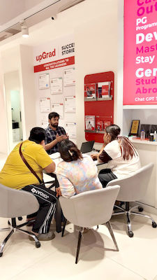 upGrad Mumbai office - student and parents with the counselling team after their study abroad session